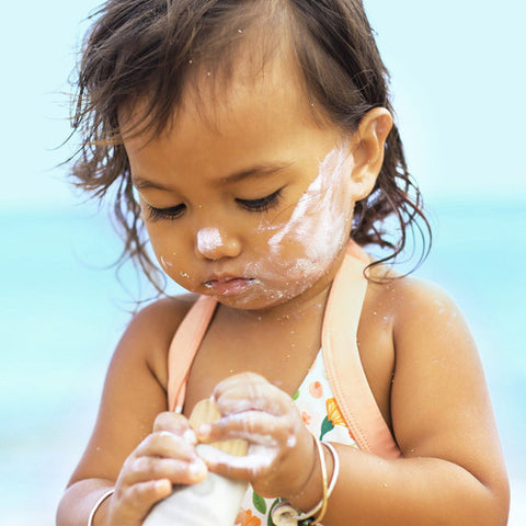 Child wearing Sun Bum Baby Bum Mineral SPF 50+ Sunscreen Lotion - Fragrance Free 88ml